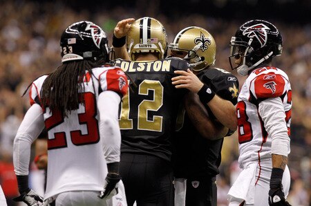 NEW ORLEANS, LA - DECEMBER 26:  Wide receiver Marques Colston #12 of the New Orleans Saints celebrates with quarterback Drew Brees #9 after Colston catches an eight-yard touchdown pass in the second quarter against the Atlanta Falcons at the Mercedes-Benz Superdome on December 26, 2011 in New Orleans, Louisiana.  <br /><br /><span class="help">(Photo by Chris Graythen/Getty Images)</span>