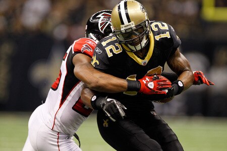 NEW ORLEANS, LA - DECEMBER 26:  Wide receiver Marques Colston #12 of the New Orleans Saints catches the ball against strong safety William Moore #25 of the Atlanta Falcons in the second quarter at the Mercedes-Benz Superdome on December 26, 2011 in New Orleans, Louisiana.  <br /><br /><span class="help">(Photo by Chris Graythen/Getty Images)</span>