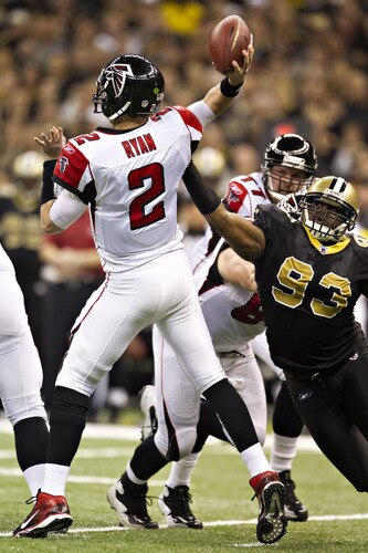 NEW ORLEANS, LA - DECEMBER 26:   Quarterback Matt Ryan #2 of the Atlanta Falcons is hit while throwing a pass by Junior Galette #93 of the New Orleans Saints at Mercedes-Benz Superdome on December 26, 2011 in New Orleans, Louisiana.  <br /><br /><span class="help">(Photo by Wesley Hitt/Getty Images)</span>