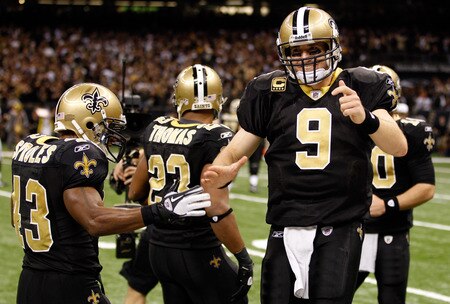NEW ORLEANS, LA - DECEMBER 26:  (R) Quarterback Drew Brees #9 of the New Orleans Saints celebrates throwing a 24-yard third quarter touchdown pass with running back Darren Sproles #43 against the Atlanta Falcons at the Mercedes-Benz Superdome on December 26, 2011 in New Orleans, Louisiana.  <br /><br /><span class="help">(Photo by Chris Graythen/Getty Images)</span>