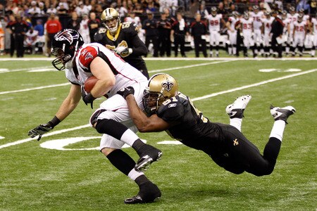NEW ORLEANS, LA - DECEMBER 26:  Tight end Michael Palmer #81 of the Atlanta Falcons runs after a catch as middle linebacker Jonathan Vilma #51 of the New Orleans Saints dives for the tackle in the third quarter at the Mercedes-Benz Superdome on December 26, 2011 in New Orleans, Louisiana.  <br /><br /><span class="help">(Photo by Chris Graythen/Getty Images)</span>