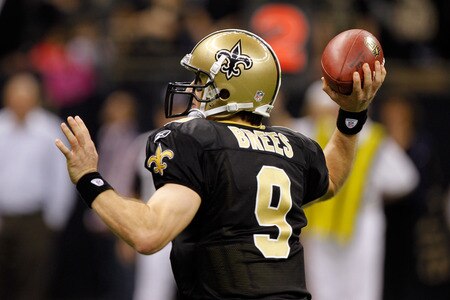 NEW ORLEANS, LA - DECEMBER 26:  Quarterback Drew Brees #9 of the New Orleans Saints throws a nine-yard touchdown pass to running back Darren Sproles #43 and breaks the single-season passing record in the fourth quarter against the Atlanta Falcons at the Mercedes-Benz Superdome on December 26, 2011 in New Orleans, Louisiana.  <br /><br /><span class="help">(Photo by Chris Graythen/Getty Images)</span>