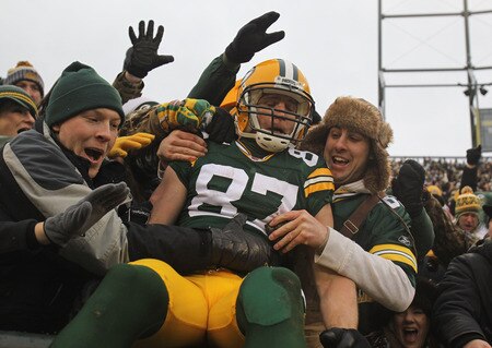 GREEN BAY, WI - JANUARY 01: Jordy Nelson #87 of the Green Bay Packers leaps into the stands after scoring a touchdown against the Detroit Lions at Lambeau Field on January 1, 2012 in Green Bay, Wisconsin. <br /><br /><span class="help">(Photo by Jonathan Daniel/Getty Images)</span>