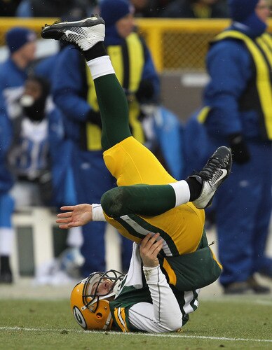 GREEN BAY, WI - JANUARY 01: Matt Flynn #10 of the Green Bay Packers flips on his back after being hit against the Detroit Lions at Lambeau Field on January 1, 2012 in Green Bay, Wisconsin. <br /><br /><span class="help">(Photo by Jonathan Daniel/Getty Images)</span>