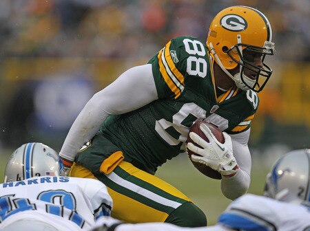 GREEN BAY, WI - JANUARY 01: Jermichael Finley #88 of the Green Bay Packers breaks away from Chris Harris #43 of the Detroit Lions for a first down at Lambeau Field on January 1, 2012 in Green Bay, Wisconsin. <br /><br /><span class="help">(Photo by Jonathan Daniel/Getty Images)</span>