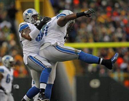 GREEN BAY, WI - JANUARY 01: (L-R) Nick Fairley #98 and Sammie Hill #91 of the Detroit Lions celebrate a fumble recovetry against the Green Bay Packers at Lambeau Field on January 1, 2012 in Green Bay, Wisconsin. <br /><br /><span class="help">(Photo by Jonathan Daniel/Getty Images)</span>