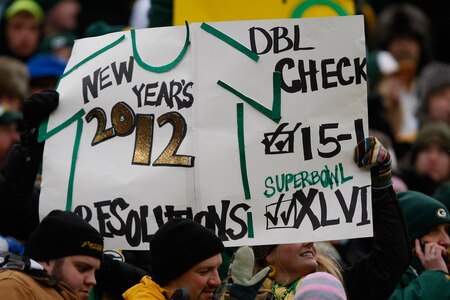 GREEN BAY, WI - JANUARY 1: A fan holds up a Aaron Rogers New Years Day Sign during the game between the Green Bay Packers against the Detroit Lions at Lambeau Field on January 1, 2012 in Green Bay, Wisconsin. <br /><br /><span class="help">(Photo by Scott Boehm/Getty Images)</span>