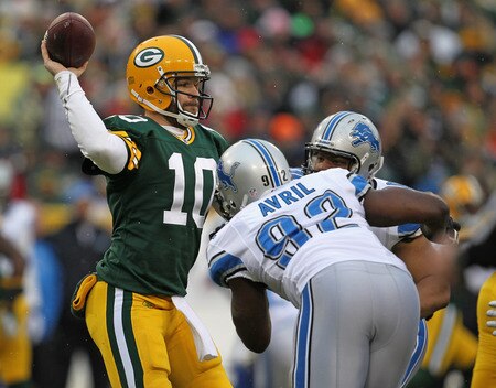 GREEN BAY, WI - JANUARY 01: Matt Flynn #10 of the Green Bay Packers throws a pass under pressure from Cliff Avril #92 and Ndamukong Suh #90 of the Detroit Lions at Lambeau Field on January 1, 2012 in Green Bay, Wisconsin. <br /><br /><span class="help">(Photo by Jonathan Daniel/Getty Images)</span>