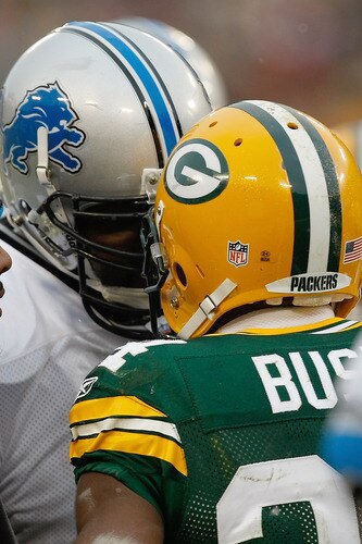 GREEN BAY, WI - JANUARY 1: Gosder Cherilus #77 of the Detroit Lions has words with Jarrett Bush #24 of the Green Bay Packers after an altercation at Lambeau Field on January 1, 2012 in Green Bay, Wisconsin. The Packers defeated the Lions 45-41. <br /><br /><span class="help">(Photo by Scott Boehm/Getty Images)</span>