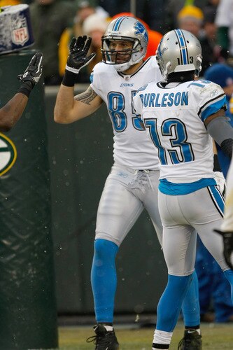 GREEN BAY, WI - JANUARY 1: Tony Scheffler #85 of the Detroit Lions celebrates a touchdown with Nate Burleson #13 during the game against the Green Bay Packers at Lambeau Field on January 1, 2012 in Green Bay, Wisconsin. The Packers defeated the Lions 45-41. <br /><br /><span class="help">(Photo by Scott Boehm/Getty Images)</span>