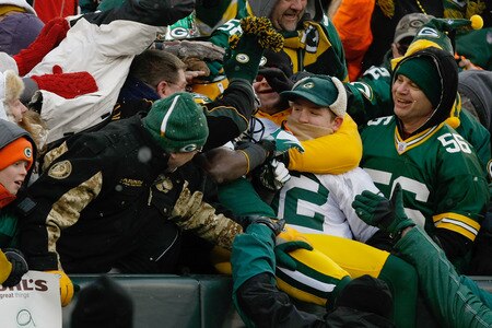 GREEN BAY, WI - JANUARY 1: Donald Driver #80 of the Green Bay Packers is swarmed by fans after scoring a touchdown during the game against the Detroit Lions at Lambeau Field on January 1, 2012 in Green Bay, Wisconsin. The Packers defeated the Lions 45-41. <br /><br /><span class="help">(Photo by Scott Boehm/Getty Images)</span>