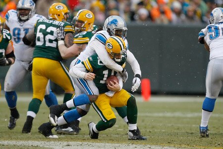 GREEN BAY, WI - JANUARY 1: Matt Flynn #10 of the Green Bay Packers is sacked by Willie Young #79 of the Detroit Lions at Lambeau Field on January 1, 2012 in Green Bay, Wisconsin. <br /><br /><span class="help">(Photo by Scott Boehm/Getty Images)</span>