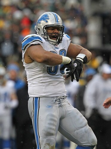 GREEN BAY, WI - JANUARY 01: Ndamukong Suh #90 of the Detroit Lions celebrates a sack against the Green Bay Packers at Lambeau Field on January 1, 2012 in Green Bay, Wisconsin. The Packers defeated the Lions 45-41. <br /><br /><span class="help">(Photo by Jonathan Daniel/Getty Images)</span>