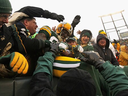 GREEN BAY, WI - JANUARY 01:  Donald Driver #80 of the Green Bay Packers jumps into the stands after scoring a touchdown against the Detroit Lions at Lambeau Field on January 1, 2012 in Green Bay, Wisconsin. The Packers defeated the Lions 45-41.  <br /><br /><span class="help">(Photo by Jonathan Daniel/Getty Images)</span>