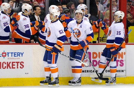 WASHINGTON, DC - JANUARY 17:  John Tavares #91 of the New York Islanders celebrates with teammates after scoring in the first period against the Washington Capitals at the Verizon Center on January 17, 2012 in Washington, DC.  <br /><br /><span class="help">(Photo by Greg Fiume/Getty Images)</span>
