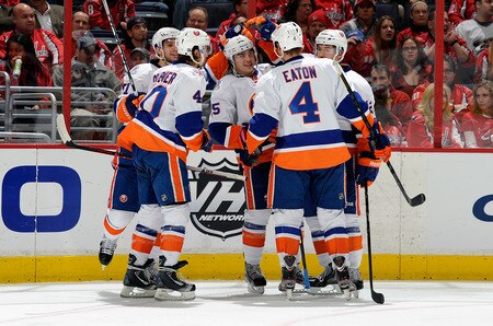 WASHINGTON, DC - JANUARY 17:  PA Parenteau #15 of the New York Islanders celebrates with teammates after scoring in the second period against the Washington Capitals at the Verizon Center on January 17, 2012 in Washington, DC.  <br /><br /><span class="help">(Photo by Greg Fiume/Getty Images)</span>