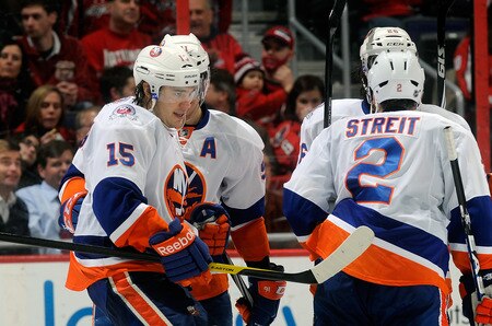 WASHINGTON, DC - JANUARY 17:  PA Parenteau #15 of the New York Islanders celebrates with teammates after scoring in the third period against the Washington Capitals at the Verizon Center on January 17, 2012 in Washington, DC. The Islanders won the game 3-0.  <br /><br /><span class="help">(Photo by Greg Fiume/Getty Images)</span>