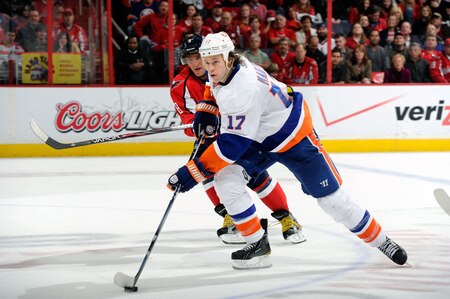 WASHINGTON, DC - JANUARY 17:  Matt Martin #17 of the New York Islanders brings the puck up the ice against Alex Ovechkin #8 of the Washington Capitals at the Verizon Center on January 17, 2012 in Washington, DC.  The Islanders won the game 3-0.  <br /><br /><span class="help">(Photo by Greg Fiume/Getty Images)</span>