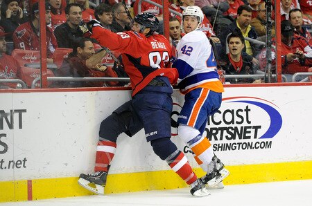 WASHINGTON, DC - JANUARY 17:  Dylan Reese #42 of the New York Islanders collides with Jay Beagle #83 of the Washington Capitals at the Verizon Center on January 17, 2012 in Washington, DC.  <br /><br /><span class="help">(Photo by Greg Fiume/Getty Images)</span>