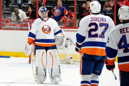 WASHINGTON, DC - JANUARY 17:  Evgeni Nabokov #20 of the New York Islanders is congratulated by teammates after a 3-0 victory against the Washington Capitals at the Verizon Center on January 17, 2012 in Washington, DC.  <br /><br /><span class="help">(Photo by Greg Fiume/Getty Images)</span>