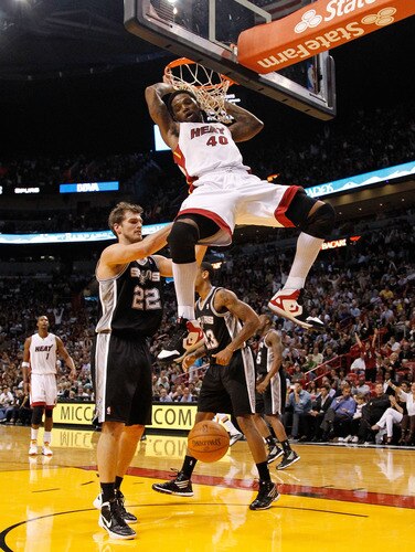 MIAMI, FL - JANUARY 17:  Udonis Haslem #40 of the Miami Heat dunks over Tiago Splitter #22 of the San Antonio Spurs during a game  at American Airlines Arena on January 17, 2012 in Miami, Florida. <br /><br /><span class="help">(Photo by Mike Ehrmann/Getty Images)</span>