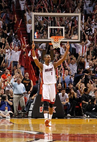 MIAMI, FL - JANUARY 17: Chris Bosh #1 of the Miami Heat reacts during a game against the San Antonio Spurs  at American Airlines Arena on January 17, 2012 in Miami, Florida. <br /><br /><span class="help">(Photo by Mike Ehrmann/Getty Images)</span>