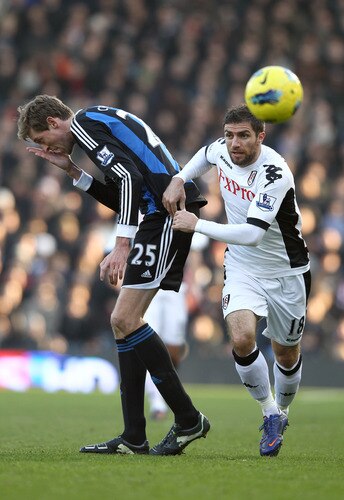 LONDON, ENGLAND - FEBRUARY 11:  Peter Crouch of Stoke City reacts after a tackle by Aaron Hughes of Fulham during the Barclays Premier League match between Fulham and Stoke City at Craven Cottage on February 11, 2012 in London, England.  <br /><br /><span class="help">(Photo by Ian Walton/Getty Images)</span>