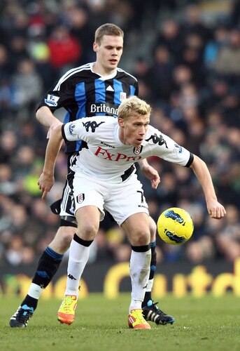 LONDON, ENGLAND - FEBRUARY 11:  Ryan Shawcross of Stoke City tries to tackle Pavel Pogrebnyak of Fulham during the Barclays Premier League match between Fulham and Stoke City at Craven Cottage on February 11, 2012 in London, England.  <br /><br /><span class="help">(Photo by Ian Walton/Getty Images)</span>