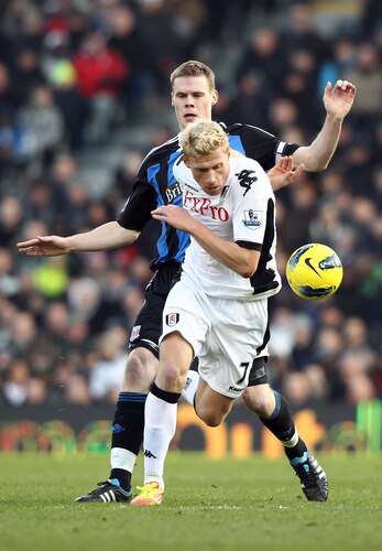LONDON, ENGLAND - FEBRUARY 11:  Ryan Shawcross of Stoke City tries to tackle Pavel Pogrebnyak of Fulham during the Barclays Premier League match between Fulham and Stoke City at Craven Cottage on February 11, 2012 in London, England.  <br /><br /><span class="help">(Photo by Ian Walton/Getty Images)</span>