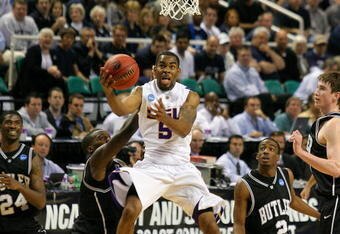 GREENSBORO, NC - MARCH 19:  Marcus Thornton #5 of the Louisiana State University Tigers drives through the defense of the Butler Bulldogs during the first round of the NCAA Division I Men's Basketball Tournament at the Greensboro Coliseum on March 19, 2009 in Greensboro, North Carolina.  (Photo by Streeter Lecka/Getty Images)