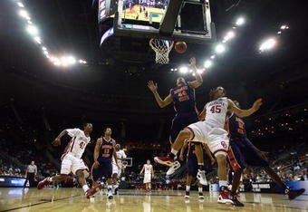 KANSAS CITY, MO - MARCH 19:  Beau Gerber #45 of the Oklahoma Sooners watches his shot as John Long #44 of the Morgan State Golden Bears looks for the rebound in the second half during the first round of the NCAA Division I Men's Basketball Tournament at the Sprint Center on March 19, 2009 in Kansas City, Missouri. The Sooners defeated the Golden Bears 82-54.  (Photo by Jamie Squire/Getty Images)