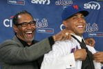 LONG ISLAND CITY, NY - DECEMBER 17:  New York Mets Manager Jerry Manuel helps Francisco Rodriquez put on a Mets jersey for the first time during a press conference to introduce him on December 17, 2008 at the Citigroup Building in New York City.  (Photo by Mike Stobe/Getty Images)