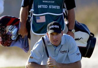 KIAWAH ISLAND, SC - NOVEMBER 13:   im Furyk of the United States lines up a putt as his caddie 'Fluff' Cowan stands behind on the 15th hole during the first round of the World Golf Championships World Cup on November 13, 2003 at the Kiawah Island Golf Resort Ocean Course on Kiawah Island, South Carolina. (Photo by Jamie Squire/Getty Images). 