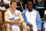 GREENSBORO, NC - MARCH 19:  Tyler Hansbrough #50 and an injured Ty Lawson #5 of the North Carolina Tar Heels cheer from the bench against the Radford Highlanders during the first round of the NCAA Division I Men's Basketball Tournament at the Greensboro Coliseum on March 19, 2009 in Greensboro, North Carolina.  (Photo by Streeter Lecka/Getty Images)