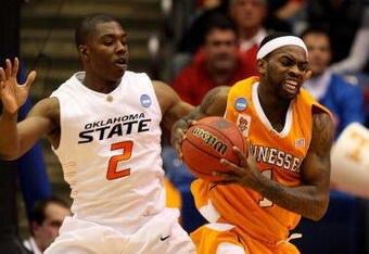 DAYTON, OH - MARCH 20: Tyler Smith #1 of the Tennessee Volunteers fights for the ball against Obi Muonelo #2 of the Oklahoma State Cowboys during the first round of the NCAA Division I Men's Basketball Tournament at the University of Dayton Arena on March 20, 2009 in Dayton, Ohio.  (Photo by Andy Lyons/Getty Images)