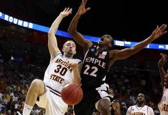 MIAMI - MARCH 20:  Guard Dionte Christmas #22 (R) of the Temple Owls is fouled by guard Rihards Kuksiks #30 of the Arizona State Sun Devils during the first round of the NCAA Division I Men's Basketball Tournament at the American Airlines Arena on March 20, 2009 in Miami, Florida.  (Photo by Marc Serota/Getty Images)