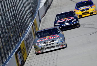 BRISTOL, TN - MARCH 20:  Scott Speed, driver of the #82 Red Bull Toyota leads Brian Vickers, driver of the #83 Red Bull Toyota and Michael Waltrip, driver of the #55 NAPA Toyota during practice for the NASCAR Sprint Cup Series Food City 500 at Bristol Motor Speedway on March 20, 2009 in Bristol, Tennessee.  (Photo by Rusty Jarrett/Getty Images)