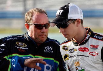HOMESTEAD, FL - NOVEMBER 14:  Ken Schrader, driver of the #96 DLP Toyota (left), talks with Brad Keselowski, driver of the #25 GoDaddy.com Chevrolet (right), during qualifying for the NASCAR Sprint Cup Series Ford 400 at Homestead-Miami Speedway on November 14, 2008 in Homestead, Florida.  (Photo by Geoff Burke/Getty Images for NASCAR)