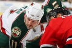 NEWARK, NJ - MARCH 20: Owen Nolan #11 of the Minnesota Wild takes the faceoff against the New Jersey Devils on March 20, 2009 at the Prudential Center in Newark, New Jersey. (Photo by Bruce Bennett/Getty Images)