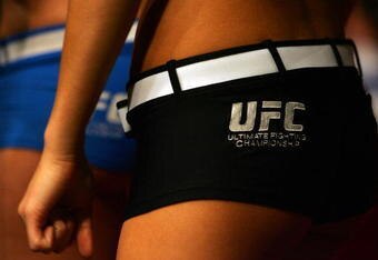 MANCHESTER, UNITED KINGDOM - APRIL 21: The card girls wait to enter the octagon during the Ultimate Fighting Championship at the Manchester Evening News Arena on April 21, 2007 in Manchester, England. (Photo by Gary M. Prior/Getty Images).