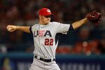 MIAMI - MARCH 14:  Starting pitcher Jake Peavy #22 of the United States pitches against Puerto Rico during round 2 of the World Baseball Classic at Dolphin Stadium on March 14, 2009 in Miami, Florida.  (Photo by Doug Benc/Getty Images)