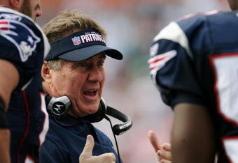 MIAMI - NOVEMBER 23:  Head coach Bill Belichick of the New England Patriots talks with his defense in the third quarter while taking on the Miami Dolphins at Dolphin Stadium on November 23, 2008 in Miami, Florida. The Patriots defeated the Dolphins 48-28.  (Photo by Doug Benc/Getty Images)