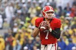 ATHENS, GA - NOVEMBER 29:  Quarterback Matthew Stafford #7 of the Georgia Bulldogs drops back to pass during the game against the Georgia Tech Yellow Jackets during the game at Sanford Stadium on November 29, 2008 in Athens, Georgia.  The Yellow Jackets beat the Bulldogs 45-42.  (Photo by Mike Zarrilli/Getty Images)
