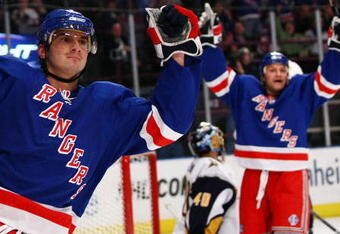 NEW YORK - MARCH 21: Nikolai Zherdev #13 of the New York Rangers celebrates his assist as Sean Avery #16 (R) celebrates scoring the goal against the Buffalo Sabres during their game on March 21, 2009 at Madison Square Garden in New York City.  (Photo by Chris McGrath/Getty Images)