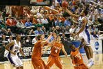 GREENSBORO, NC - MARCH 21:  Gerald Henderson #15 of the Duke Blue Devils lays in a basket against A.J. Abrams #3 and Clint Chapman #53 of the Texas Longhorns during the second round of the NCAA Division I Men's Basketball Tournament at the Greensboro Coliseum on March 21, 2009 in Greensboro, North Carolina.  (Photo by Streeter Lecka/Getty Images)