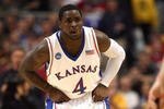 MINNEAPOLIS - MARCH 20:  Sherron Collins #4 of the Kansas Jayhawks defends against the North Dakota State Bison during the first round of the NCAA Division I Men's Basketball Tournament at the Hubert H. Humphrey Metrodome on March 20, 2009 in Minneapolis, Minnesota. Kansas won 84-74. (Photo by Jonathan Daniel/Getty Images)