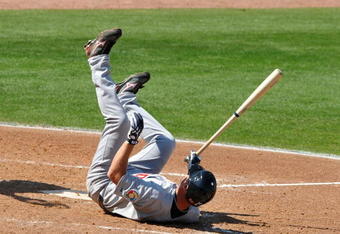 DUNEDIN, FL - MARCH 5: Infielder Chipper Jones #10 of Team USA tumbles after fouling a pitch against the Philadelphia Phillies March 5, 2009 at  Bright House Field in Dunedin, Florida.  (Photo by Al Messerschmidt/Getty Images)