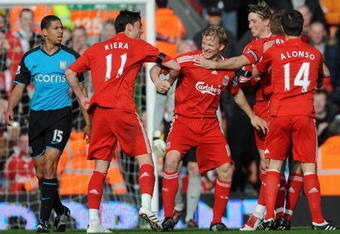 LIVERPOOL, UNITED KINGDOM - MARCH 22:  Dirk Kuyt of Liverpool celebrates with his team mates after scoring the opening goal during the Barclays Premier League match between Liverpool and Aston Villa at Anfield on March 22, 2009 in Liverpool, England.  (Photo by Shaun Botterill/Getty Images)
