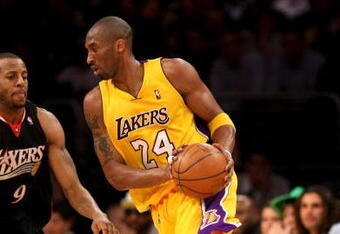 LOS ANGELES - MARCH 17:   Kobe Bryant #24 of the Los Angeles Lakers drives around Andre Iguodala #24 of the Philadelphia 76ers on March 17, 2009 at Staples Center in Los Angeles, California.  The 76ers won 94-93.   NOTE TO USER: User expressly acknowledges and agrees that, by downloading and/or using this Photograph, user is consenting to the terms and conditions of the Getty Images License Agreement. (Photo by Stephen Dunn/Getty Images)