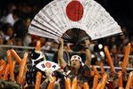 SAN DIEGO - MARCH 17: Japanese fans cheer for their team as they play against Korea during the 2009 World Baseball Classic Round 2 Pool 1 Game 4 on March 17, 2009 at Petco Park in San Diego, California.  (Photo by Donald Miralle/Getty Images)